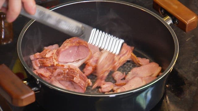 Cooking smoked duck in a pot on the stove