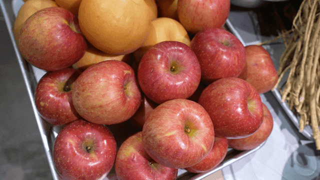 Variety of fresh apples and pears