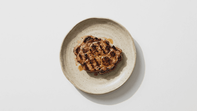 Grilled meat on a ceramic plate