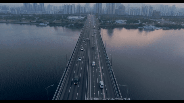 Bridge over a river with city skyline