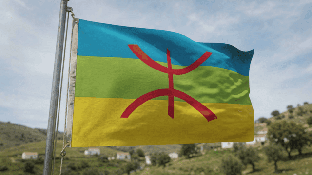 Colorful Berber flags fluttering in field