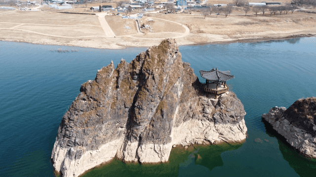 Traditional pavilion on rocky island