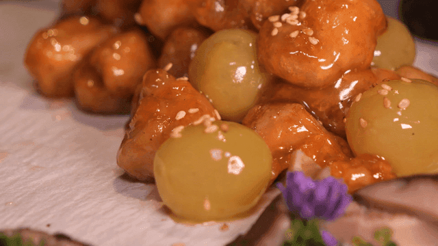 Grape chicken tangsuyuk topped with sesame seeds