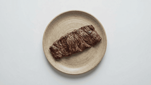 Grilled steak on a ceramic plate