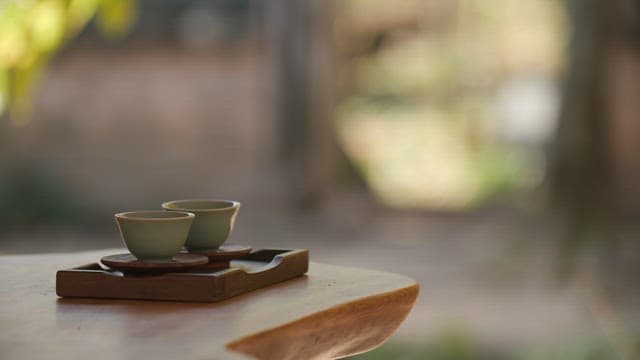 Serene Tea Set on Wooden Table Outdoors