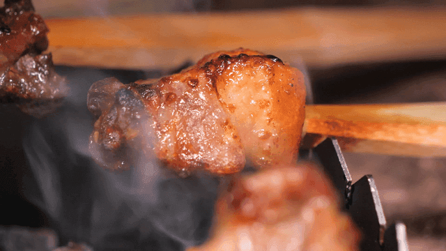 Grilled meat skewers sizzling on a grill