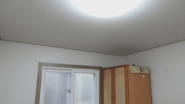 Simple room with a window and furniture