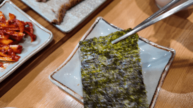 Seaweed picked up with chopsticks