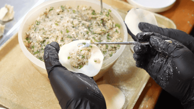 Preparing dumplings with filling