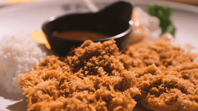 Crispy pork cutlet served with rice