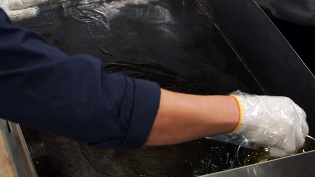 Rubbing oil on a hot griddle