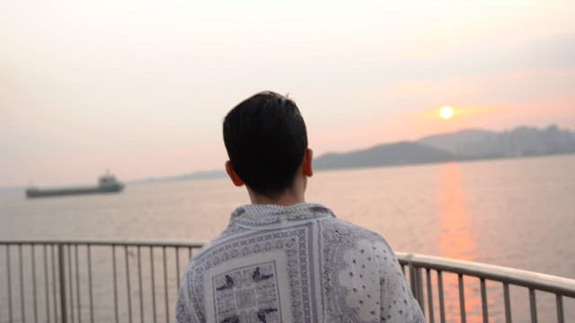 Man watching sunset by the sea