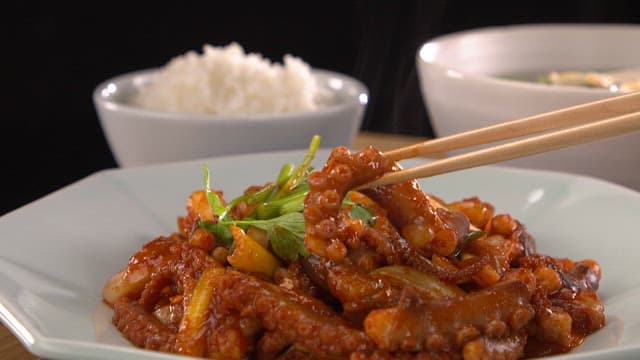 Chopstickful of delicious spicy stir-fried octopus