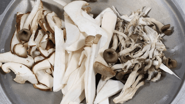 Various mushrooms prepared in a bowl
