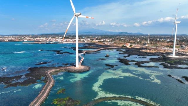 Coastal wind turbines and clear sea