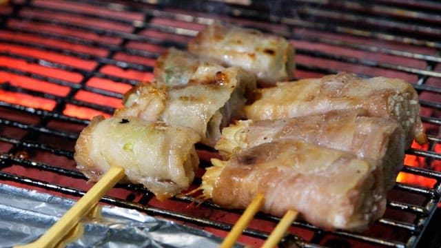 Grilled skewers sizzling deliciously on a red-hot grill