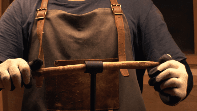 Craftsman precisely drilling wood with a hand drill