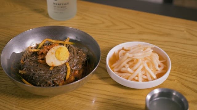 Bibim Naengmyeon and Raddishon a Wooden Table