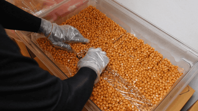 Oranda snack being arranged in a container