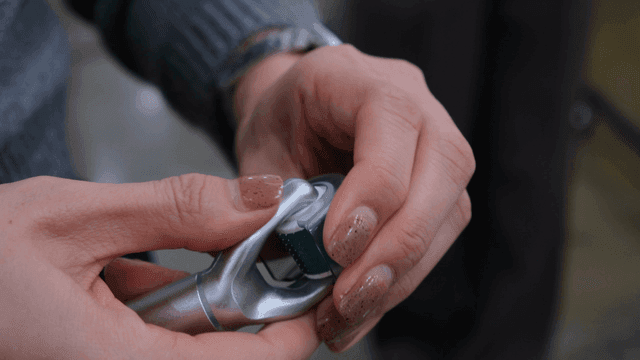 Hands holding a skincare roller