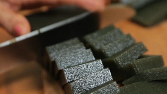 Korean green jelly cut with a knife on a cutting board