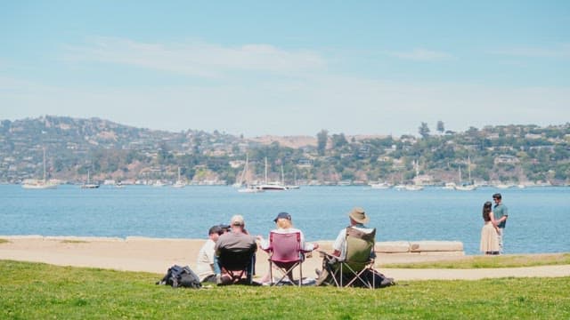Relaxing by the Waterfront Overlooking Sailboats