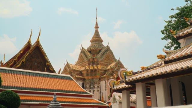 Tourists visiting the colorful and ornate temples of Thailand