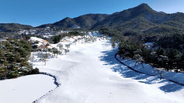 Serene Snowy Mountain Landscape with Road