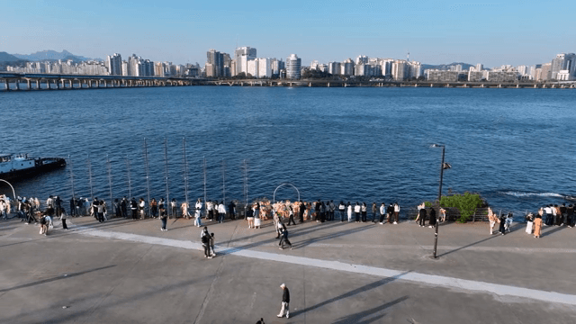 People enjoying a riverside view in the city