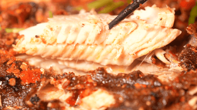 Soft Mala Kao Yu fish fillet picked up with chopsticks