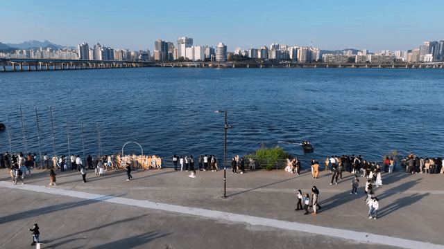 People enjoying a riverside view in the city