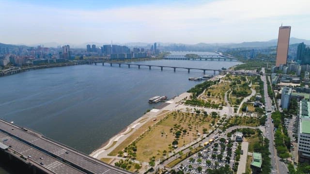 Park Riverfront of City and Bridge