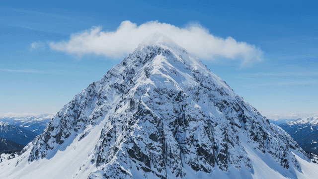 Snow-covered mountain peak under a clear sky