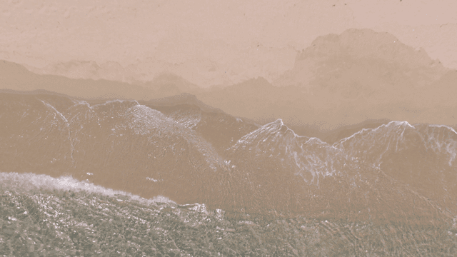 Waves gently lapping on a sandy beach