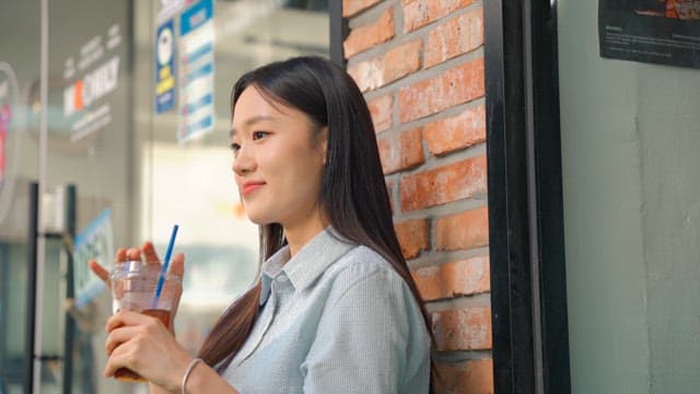 Young woman relaxing and drinking coffee