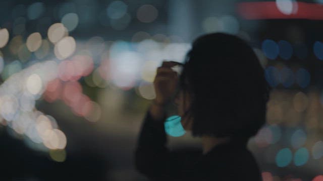 Woman Stroking Her Hair with a Complicated Expression