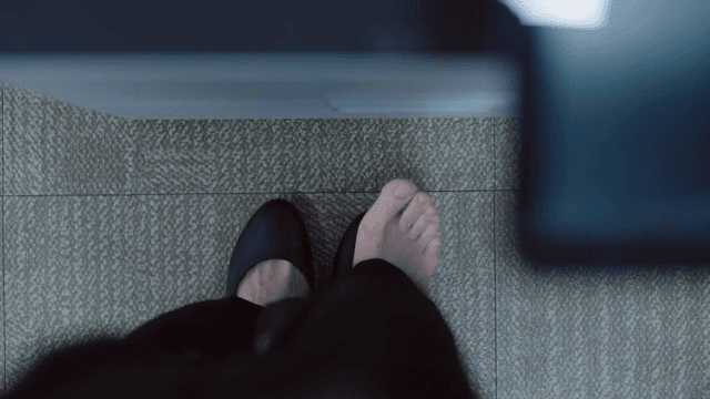 Female employee's feet wearing damaged shoes