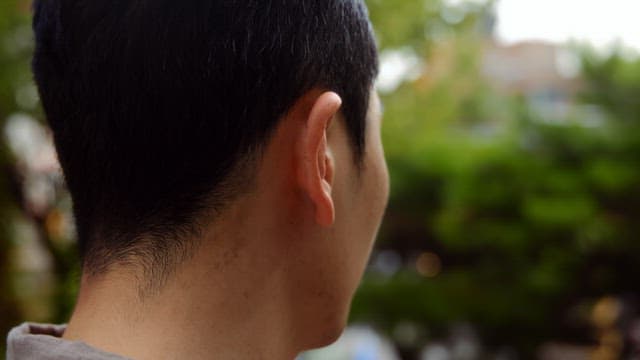 Man looking around outdoors