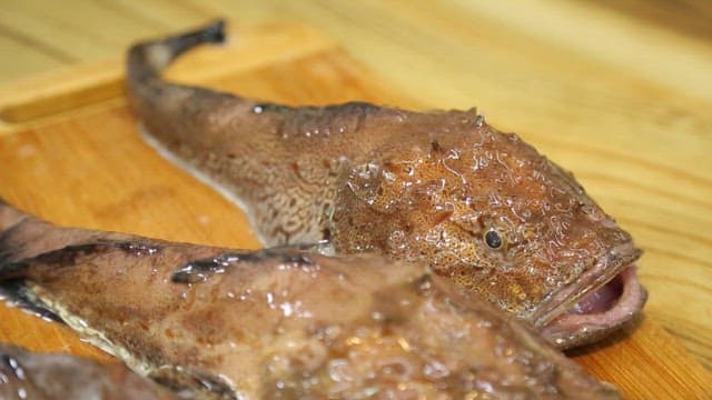 Fresh fish on a wooden cutting board