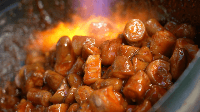 Stir-fried pork intestines cooked with torch flame