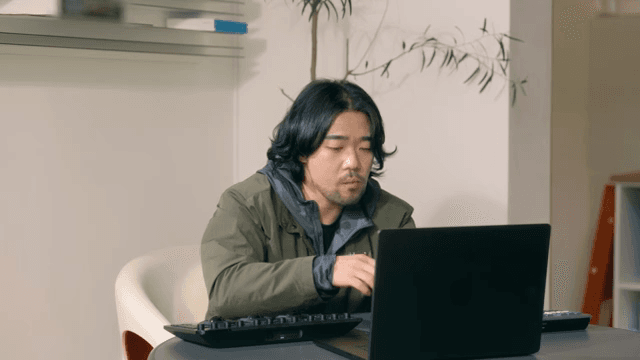 Man working on a laptop indoors