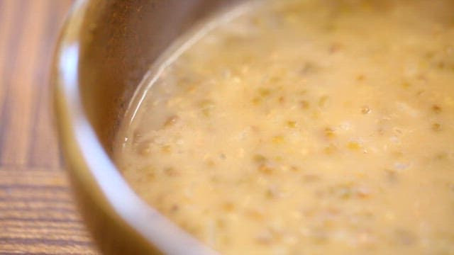 Bowl of steaming Korean chicken porridge