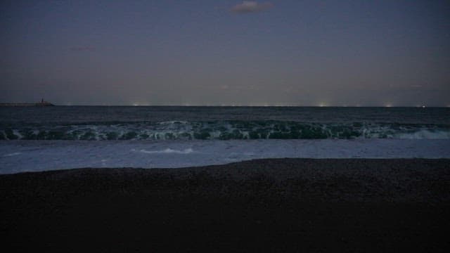 Beach at night with waves crashing hard