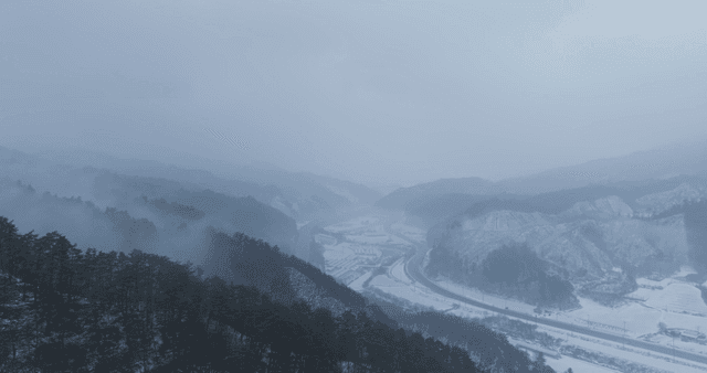 Snow-covered mountains and winding roads