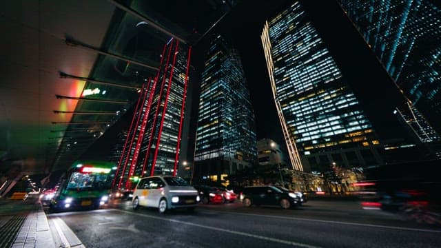 Bustling City Street at Night with Traffic