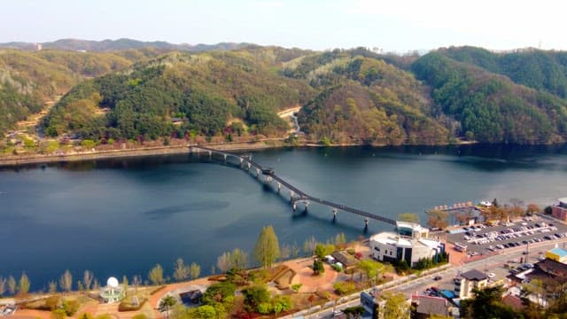 Scenic river with a bridge and mountains