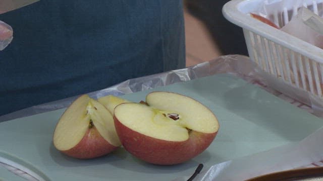 Slicing an apple on a cutting board