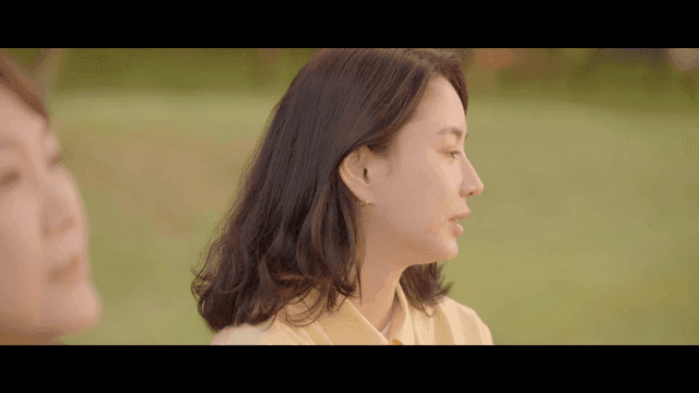 Two women having a conversation outdoors