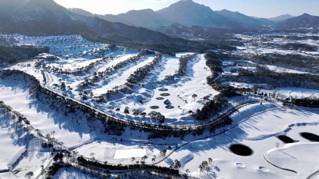 Snow-covered Landscape with Winding Paths