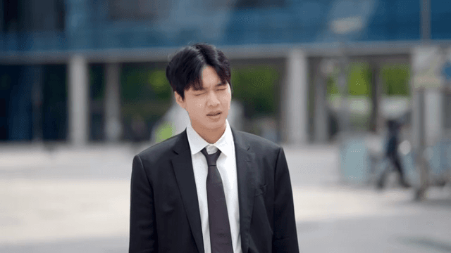 Office worker loosening his tie with an annoyed expression